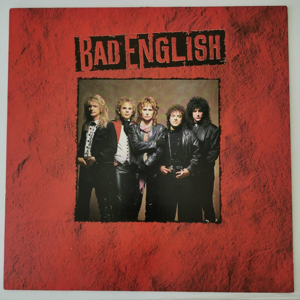 The album cover of Bad English's 'The Great Escape' vinyl record, featuring a textured red border with the band's name in black stencil lettering and a central photo of the five band members.