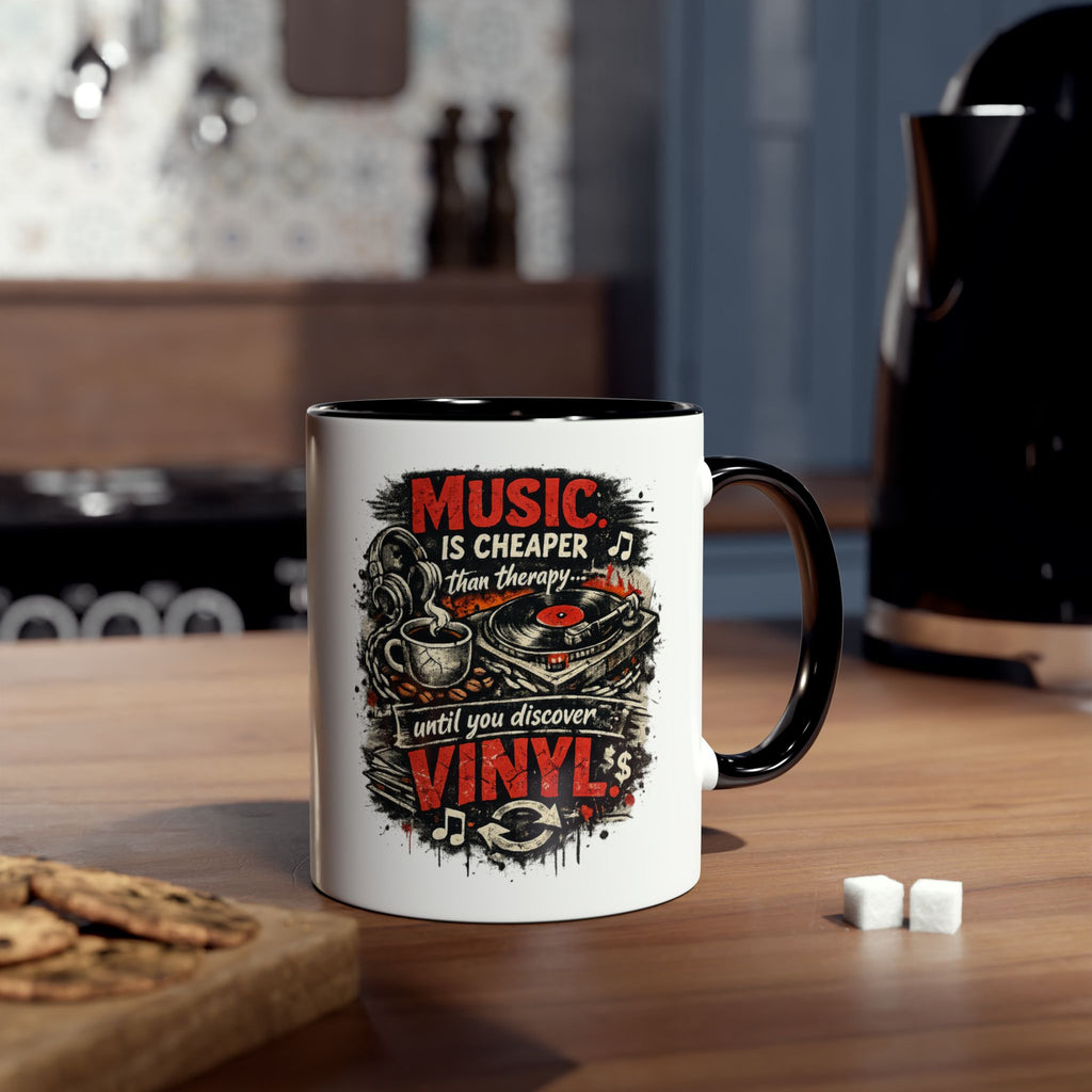 A white ceramic coffee mug with a black handle and interior, featuring a graphic print that reads 'MUSIC IS CHEAPER THAN THEORY.