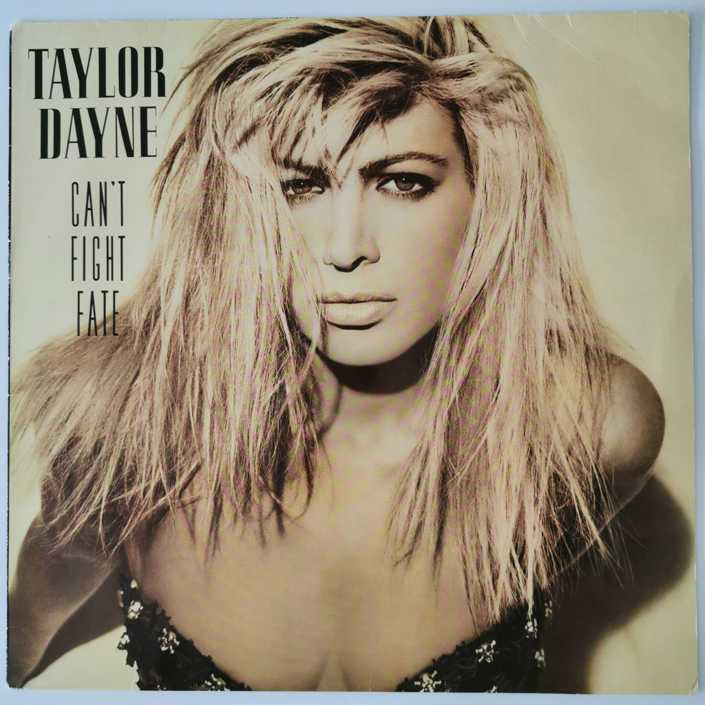 Taylor Dayne 'Can't Fight Fate' vinyl record cover, featuring a close-up portrait of the artist with blonde hair and the album title in bold black text on the left.