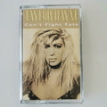 Taylor Dayne 'Can't Fight Fate' cassette tape in a clear plastic case, featuring a sepia-toned portrait of the artist with gold lettering.