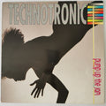Vinyl record cover for Technotronic's 'Pump up the jam', featuring a large black silhouette of a person against a warm beige background with bold title text and a colorful striped graphic.