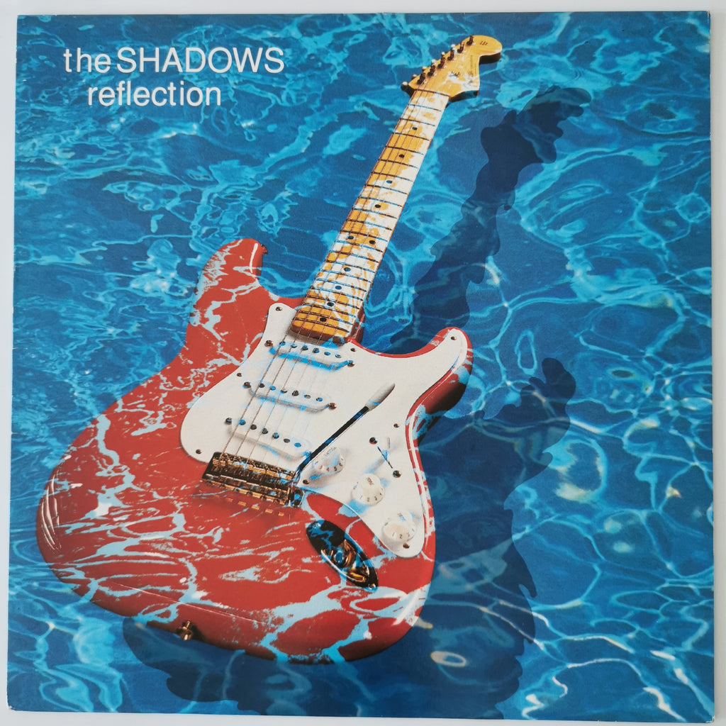 Album cover for 'reflection' by the band 'the SHADOWS', featuring a red and white electric guitar floating on blue water with ripples and the band's name in the top left corner.