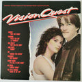Vinyl record cover for the original soundtrack of the Warner Bros. motion picture Vision Quest, featuring a black background with the title in large red and white script, a list of tracks on the left, and a photo of a young couple on the right.